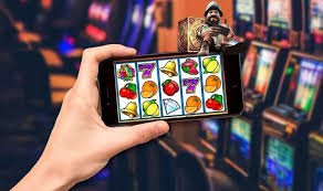 Tampilan permainan Mahjong Ways 2 di layar smartphone jitu10 dengan simbol-simbol mahjong dan tombol putar